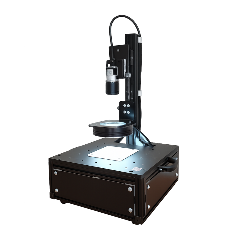 表面 3D 観察装置 TR-55 の本体写真。上部の撮像ヘッドと、試料を置く白いステージが見える。